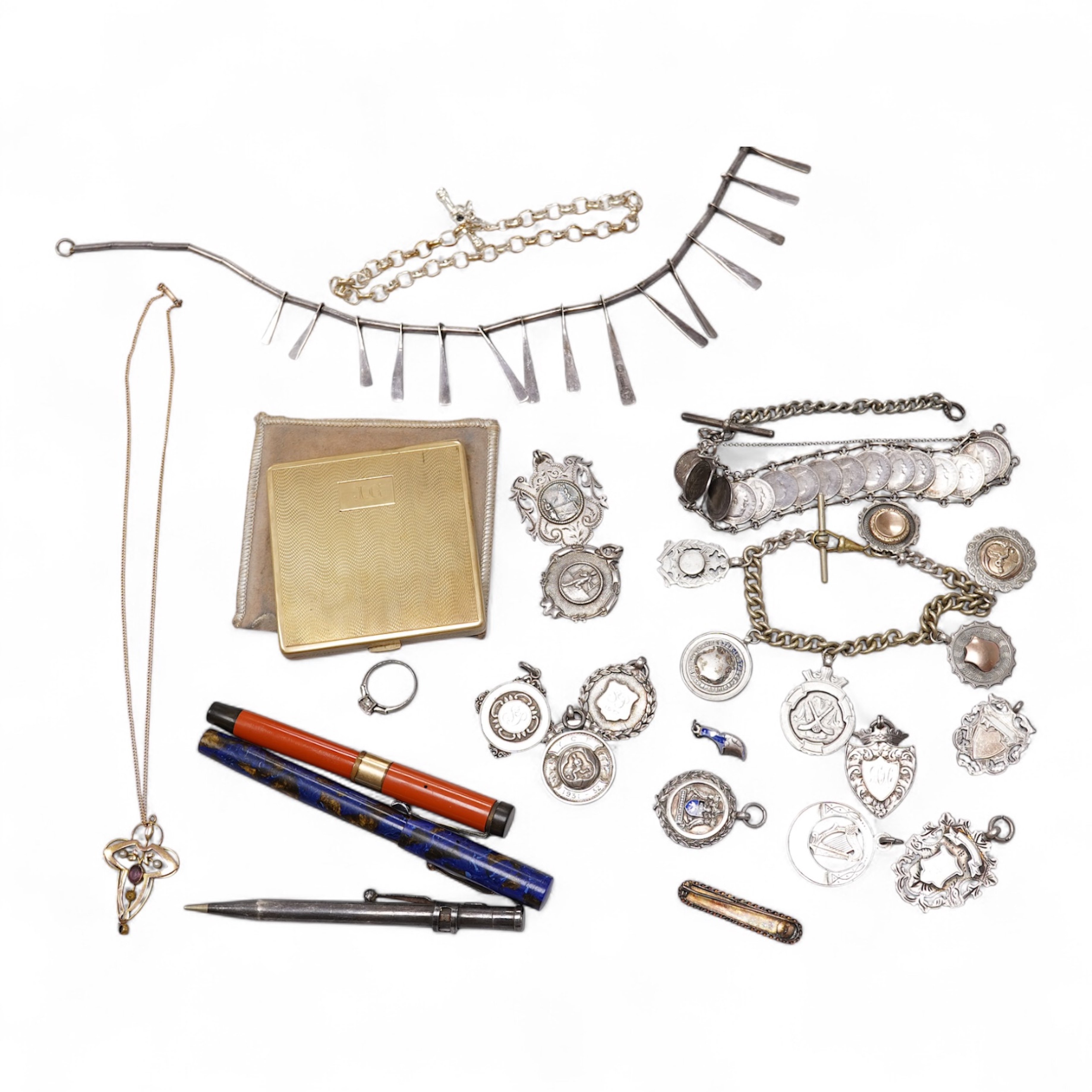 An early 20th century yellow metal, amethyst and seed pearl set pendant, 41mm, on a yellow metal chain, together with other assorted jewellery and other items including a late Victorian 9ct gold brooch, a coin bracelet,